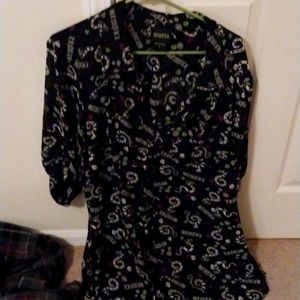 This is a long oversized Beetlejuice themed button-up